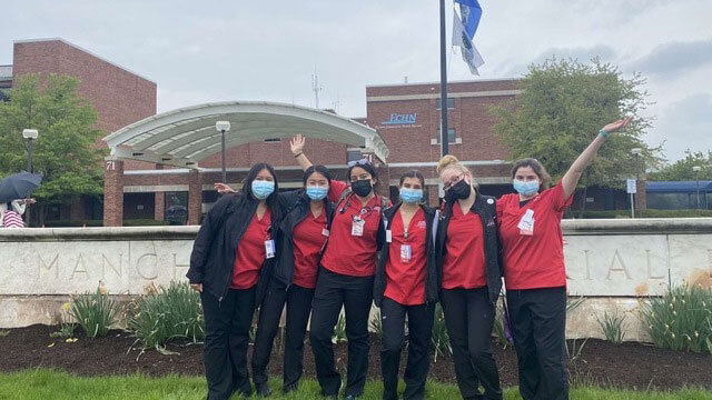 nursing students in front of Manchester Memorial Hospital