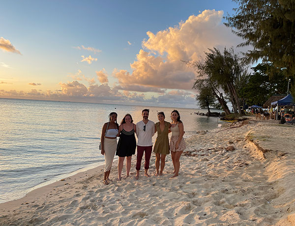 four students in Saipan on the beach