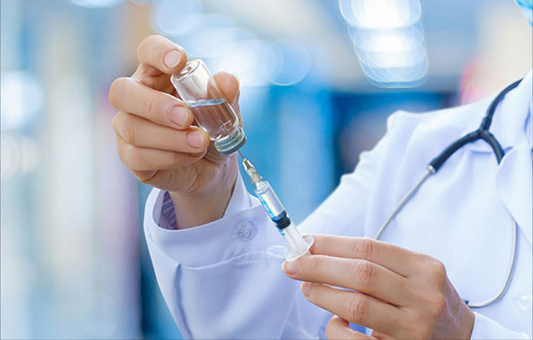 healthcare provider administering injection