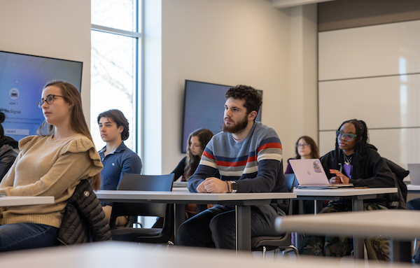 Barney finance students listen to a lecture in class