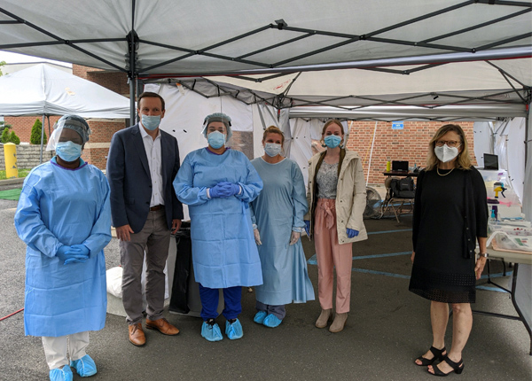 Annie Odell A'19, '21, second from right, was on hand when Connecticut U.S. Senator Christopher Murphy visited CIFC's COVID-19 testing site in mid-July.  