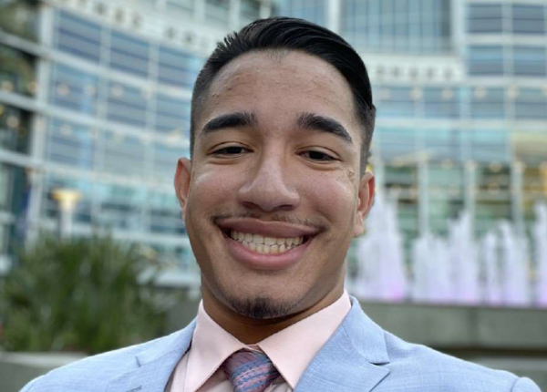 Male electromechanical engineering technology student smiling.