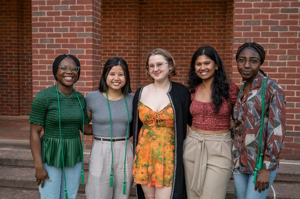 First-Gen students before commencement with green cords