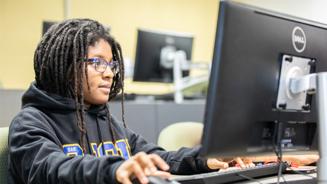 student studying at a computer