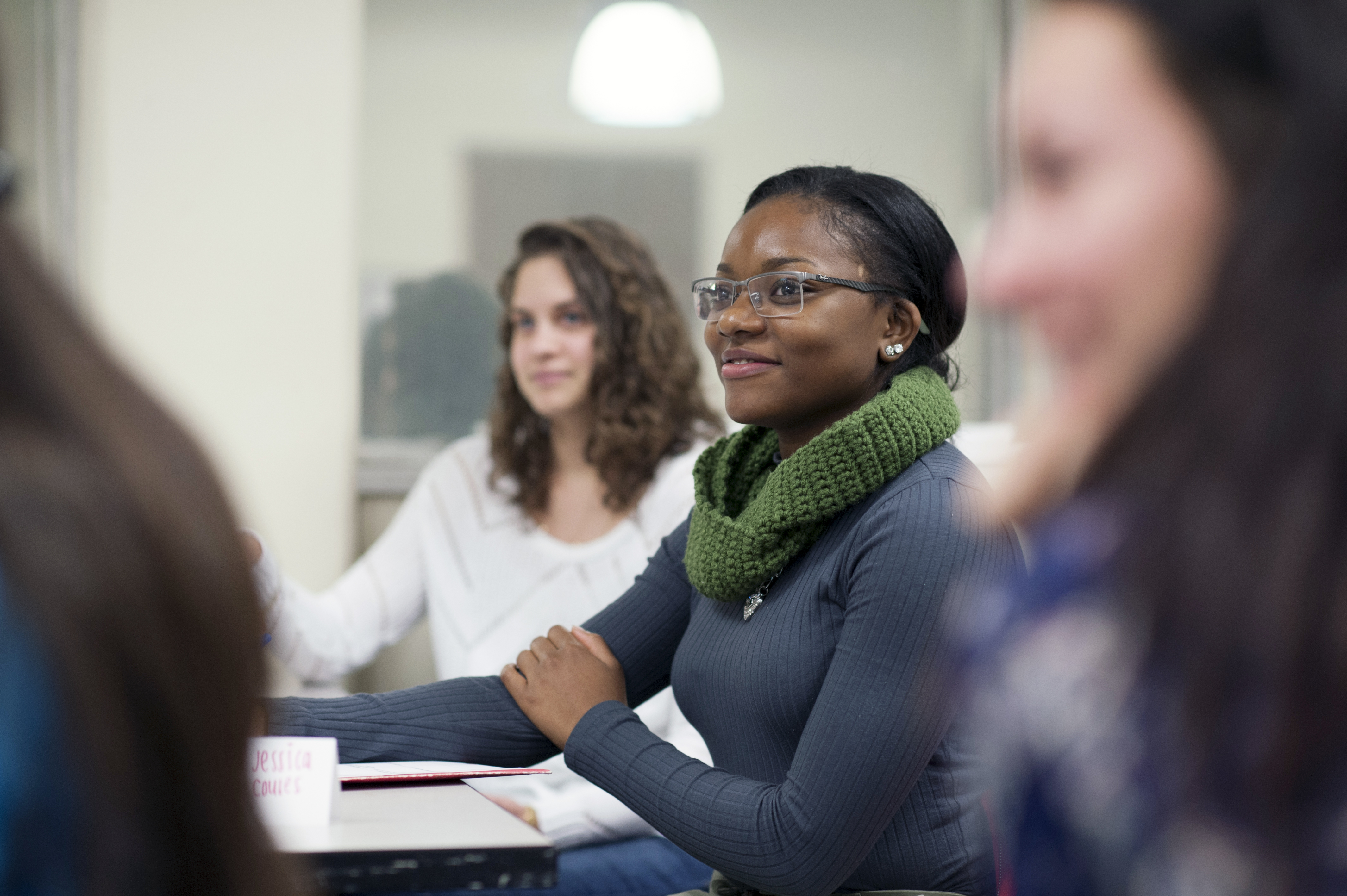 a group of students are writing notes during a lesson