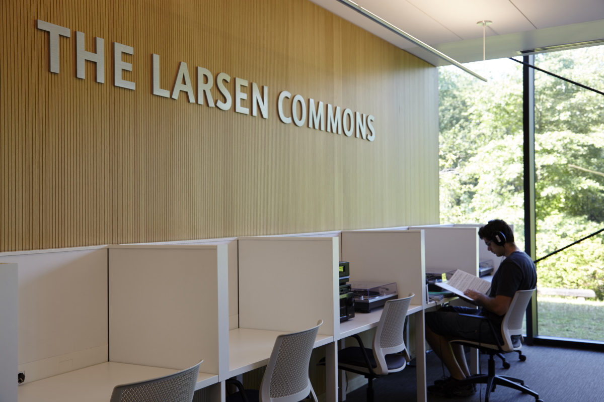 student using a listening station in Allen Library