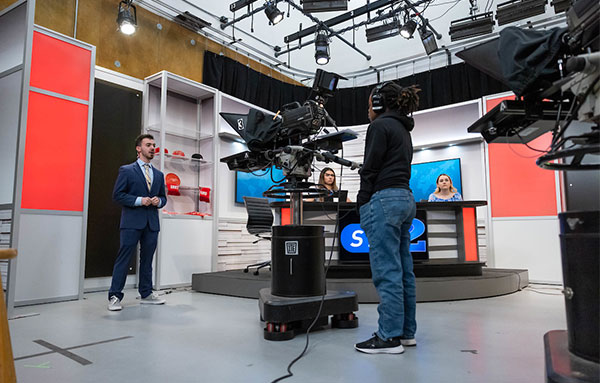 students working in news room