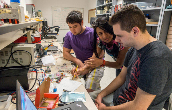 Students working in Physics lab. 