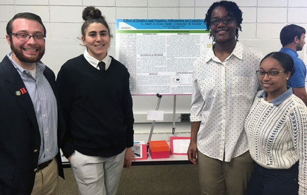 Students making poster presentation.