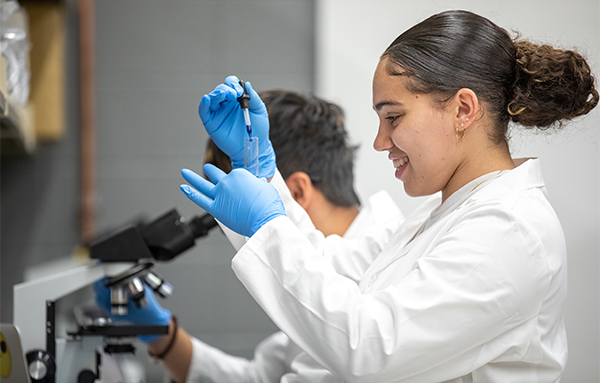 Student with microscope