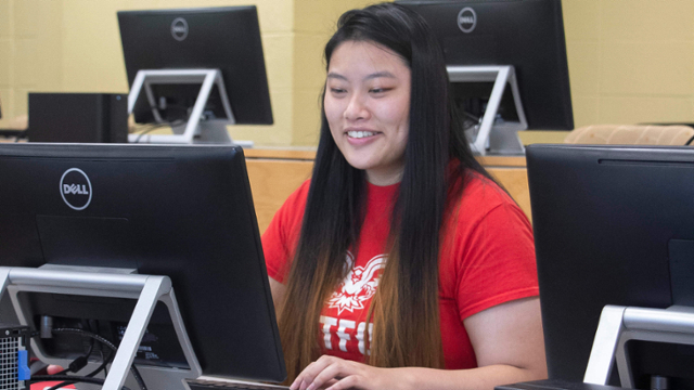 Student at Computer. 