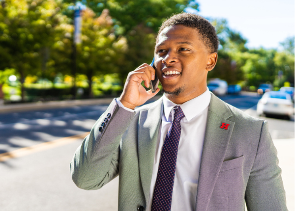 student on phone outside