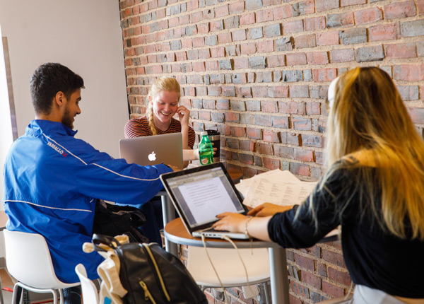 Students studying in cafeteria
