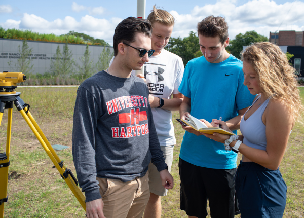 Student group completing outdoor civil engineering project