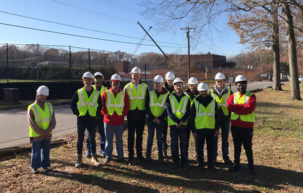 students standing in construction site