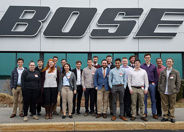 people standing in front of BOSE building