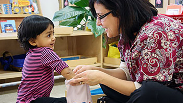 Montessori teacher and child