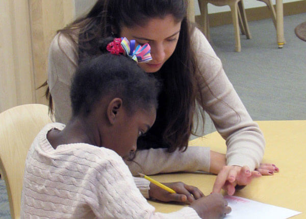 Teacher with elementary student