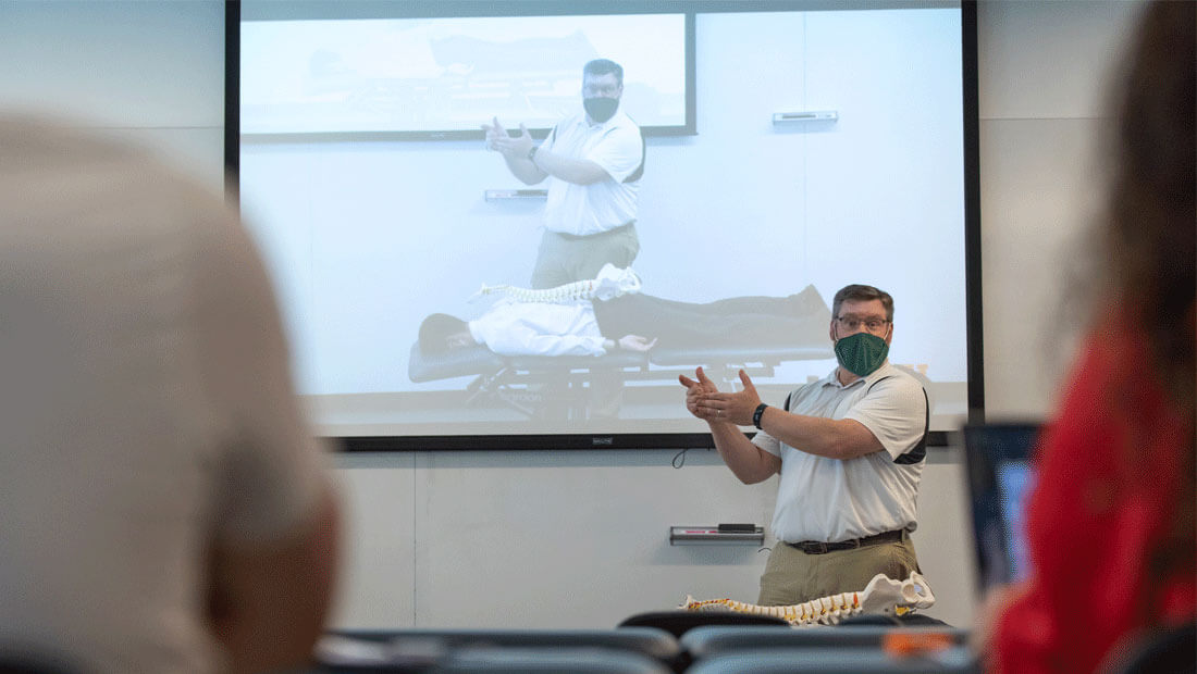Professor teaching physical therapy class in Hursey Center
