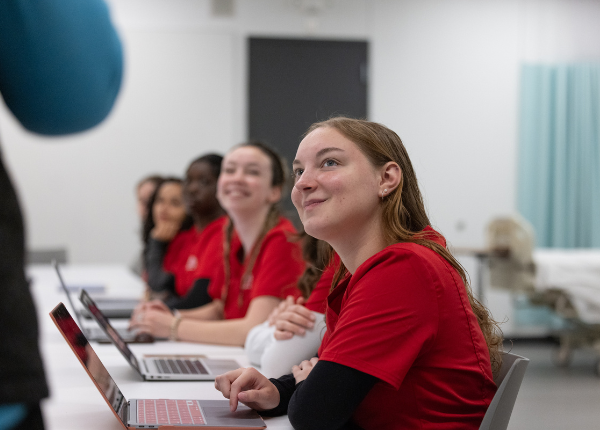 Nursing Student Learning at Table