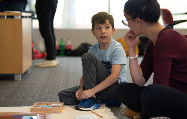 Teacher with elementary student