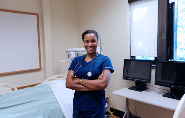nurse standing in simulation lab