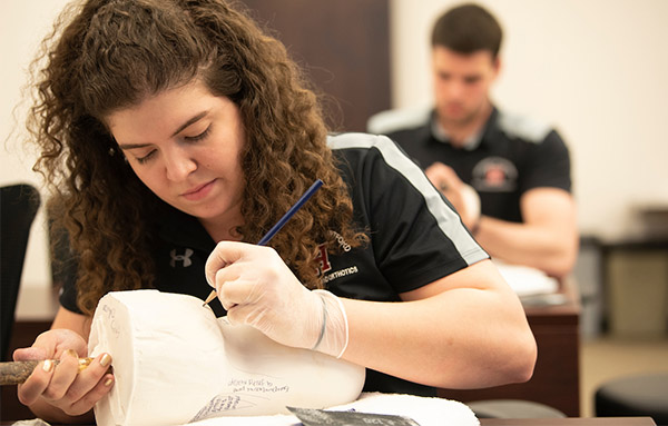 student making a cast