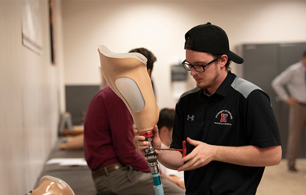 student working in prosthetics lab