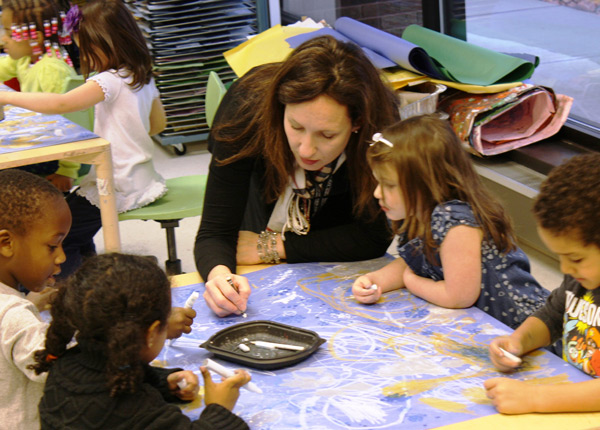 teacher with young students