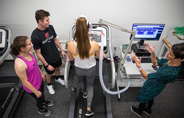 Exercise Science students with treadmill and metabolic cart