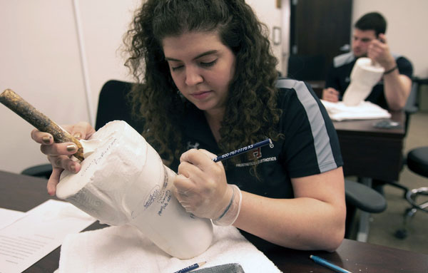 Student with prosthetic cast