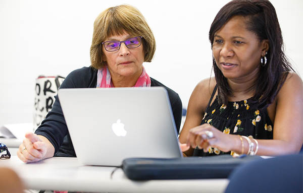 two nurses at a computer