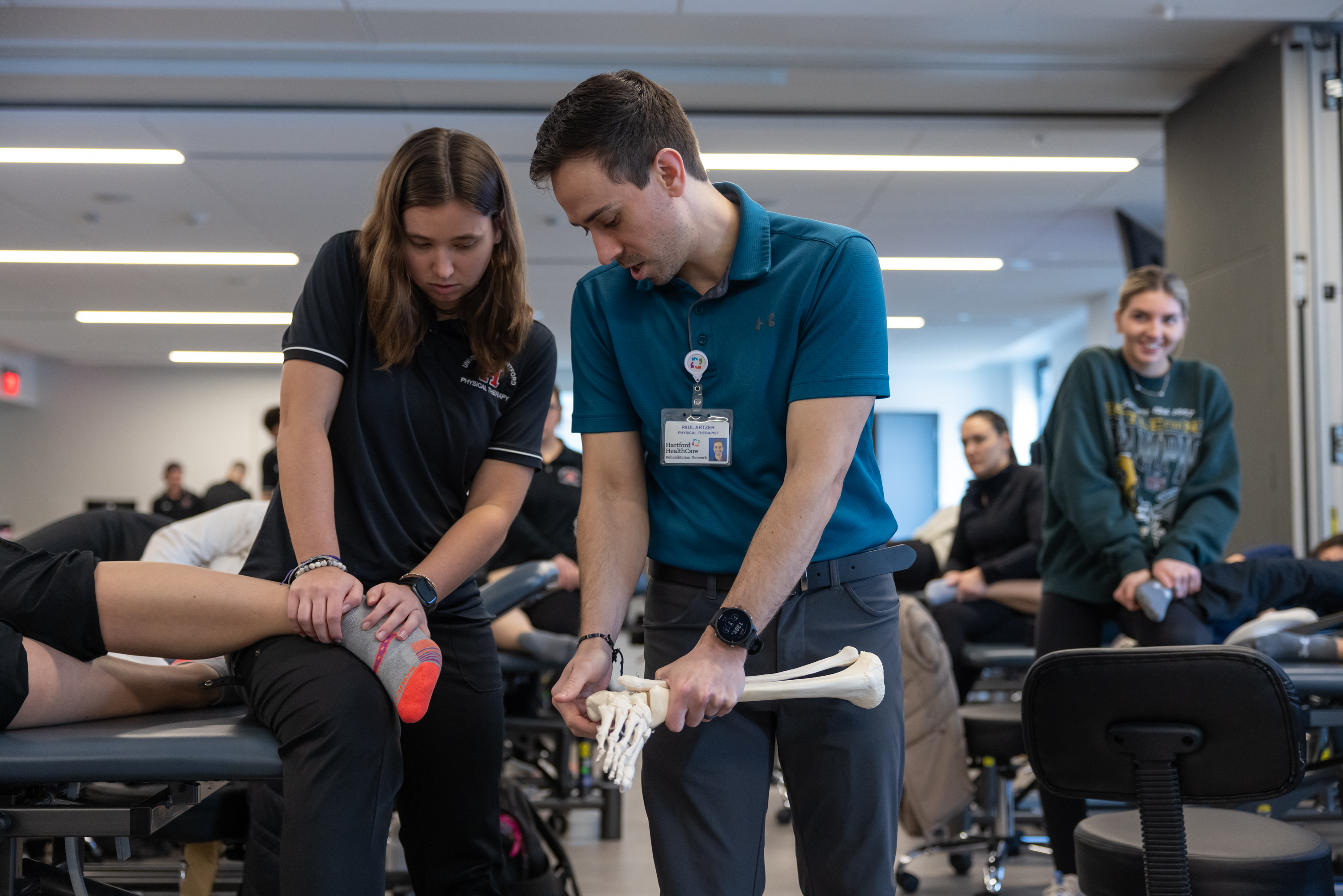 Physical therapy student working on ankle
