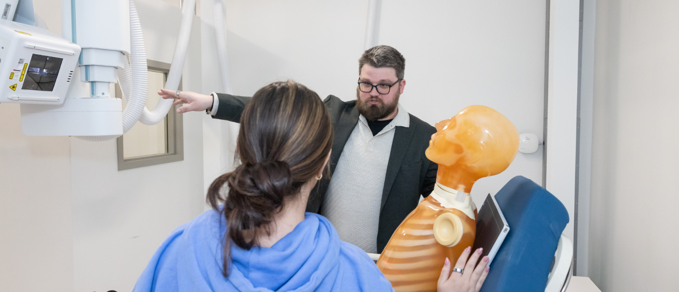 Professor with student and imaging equipment