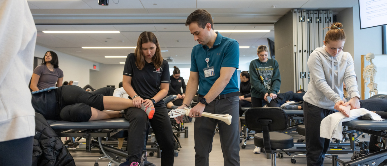 Physical therapy student practicing experiential learning with clinical partner 