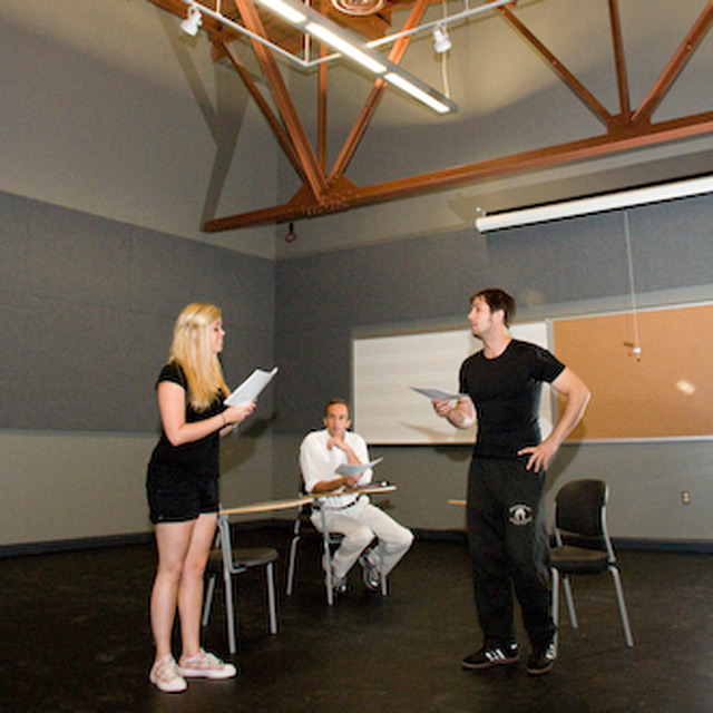 Students working in a theatre space