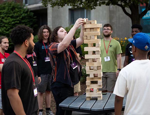 Hillyer College Early Arrival Students playing Jenga in Alumni Plaza.