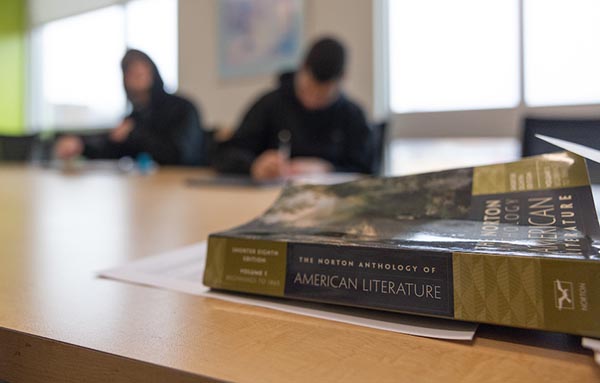 Students in Classroom and Literature Text Book