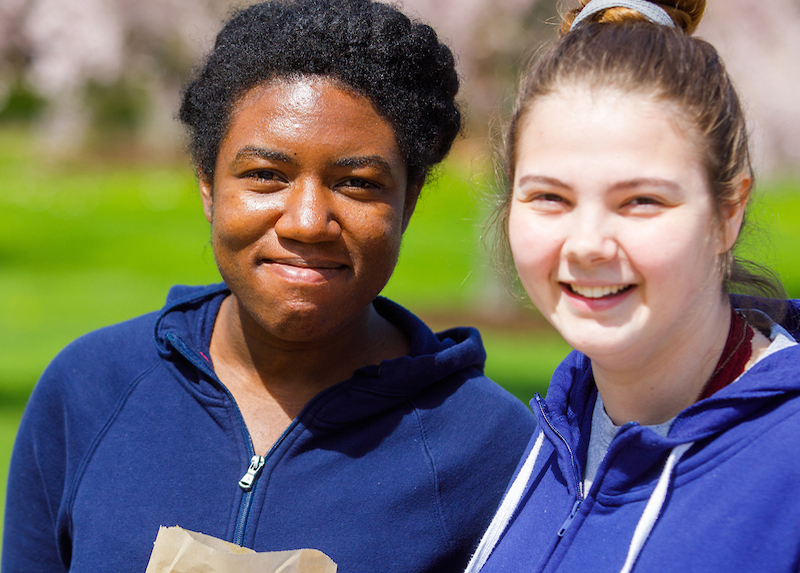Image is of two students smiling