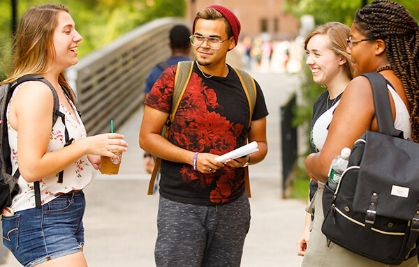 students talking on campus