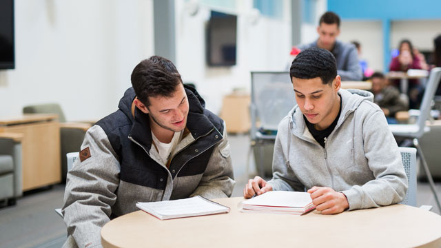 Uhart students walking across campus