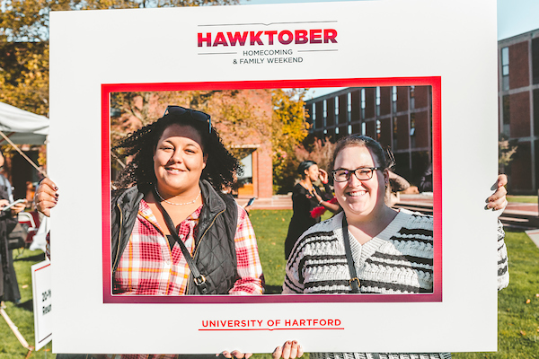image is of two alumni at hawktober