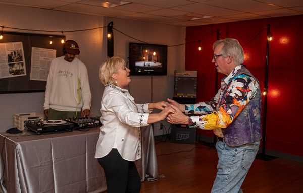 Two UHart alumni dancing together at the 50(ish) Reunion Pub.