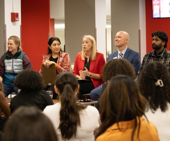 Alex Coury '08, M'10 and other alumni speaking to students about their career experiences.