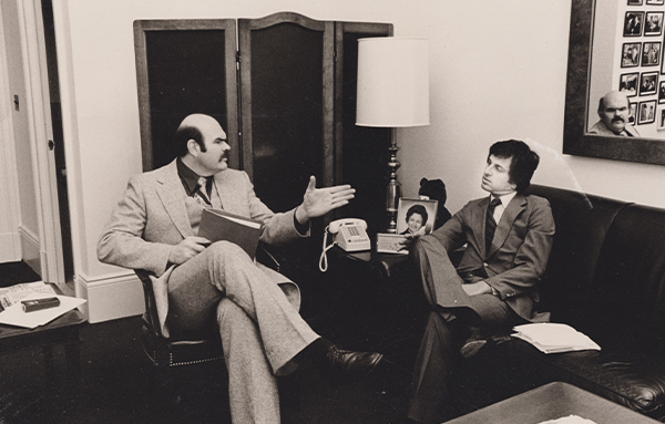 Francis Besancon talking with another person