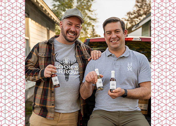 Henry and Sam Dziekan holding their hot sauce