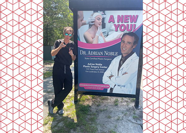 James Ford posing in front of a poster for the ABC Pilot, RJ DECKER