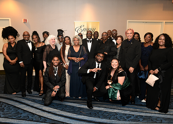 large group of people posing for a photo