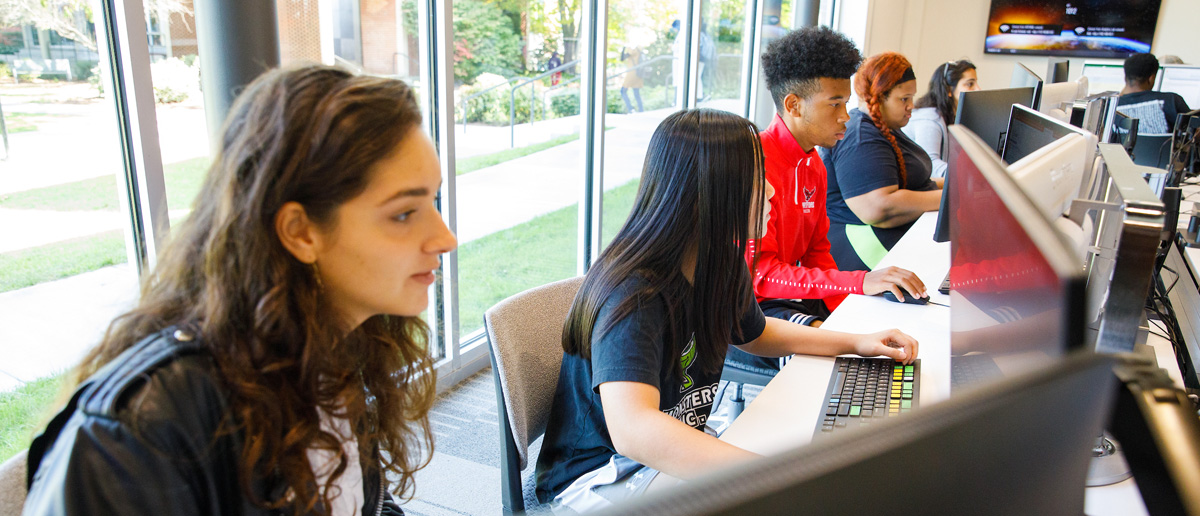 UHart students sitting in a classroom.