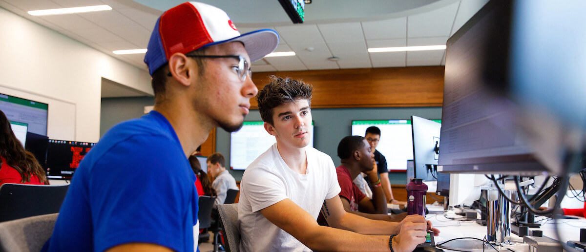 Barney students having a discussion at the trading lab